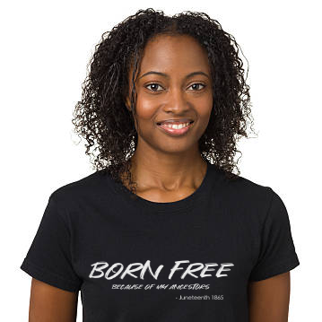 Person wearing a black t-shirt with 'Born Free' text on a white background